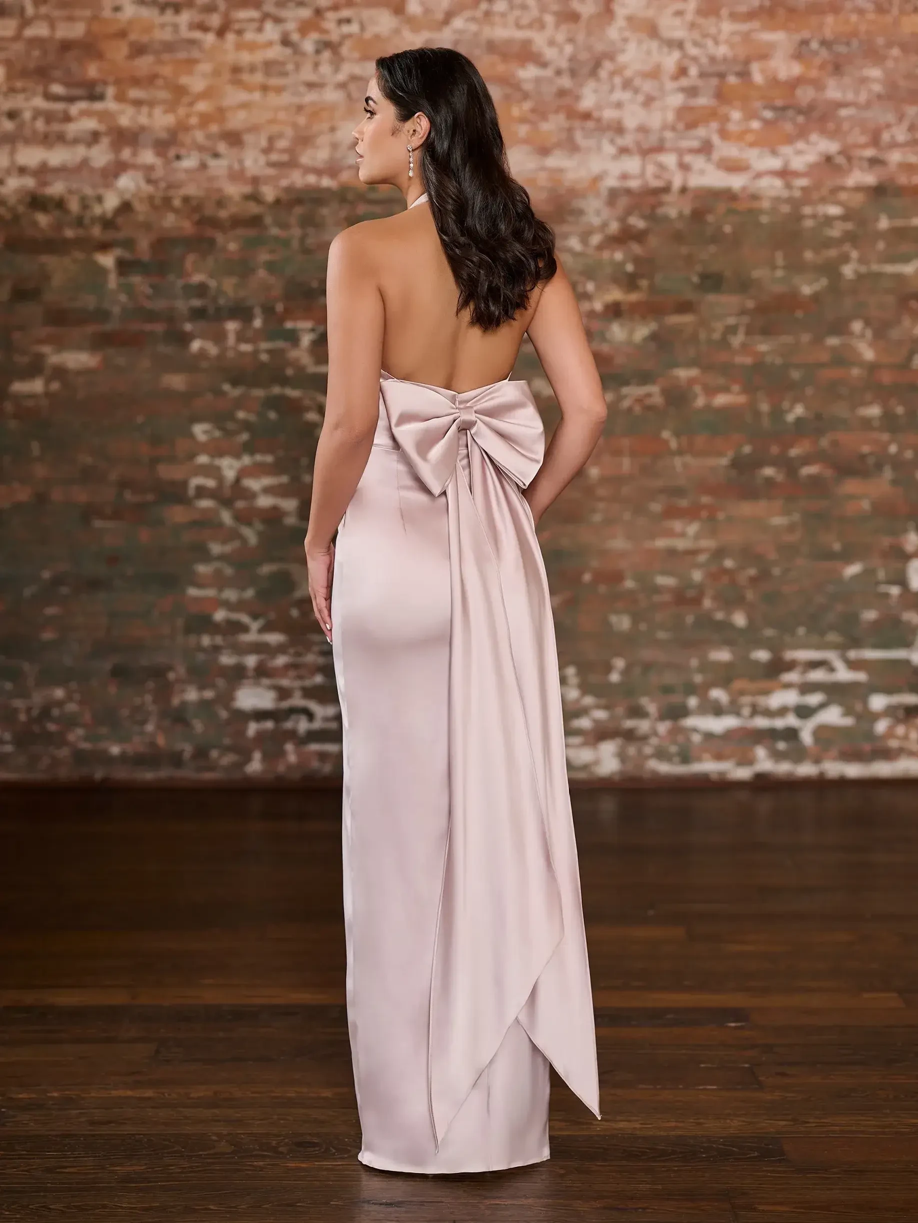 Model is wearing a column charmeuse light pink bridesmaid dress