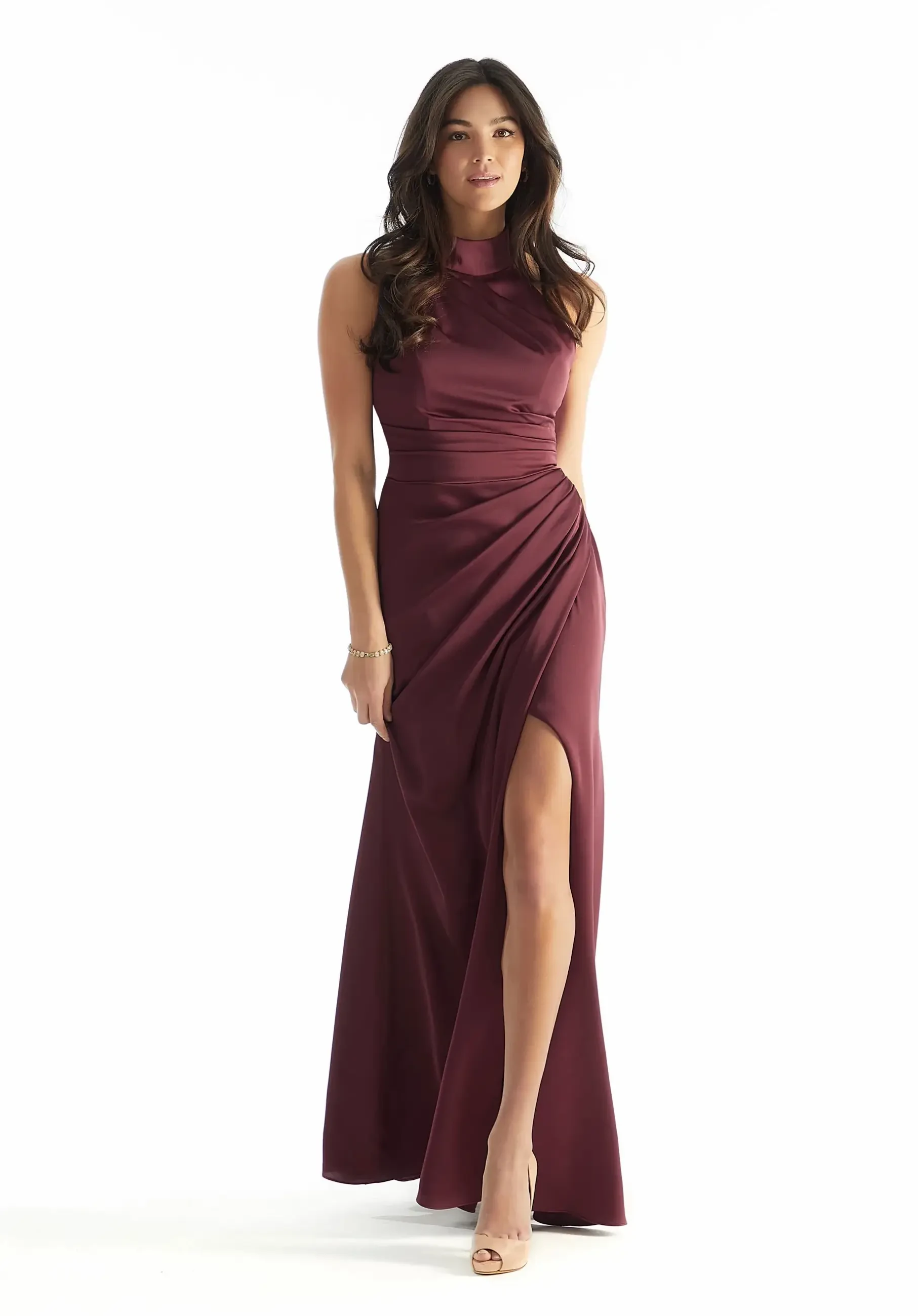 Model is wearing a Morilee 31224, a wine-colored collar-style halter satin sheath with a curve-hugging fit and front skirt slit.