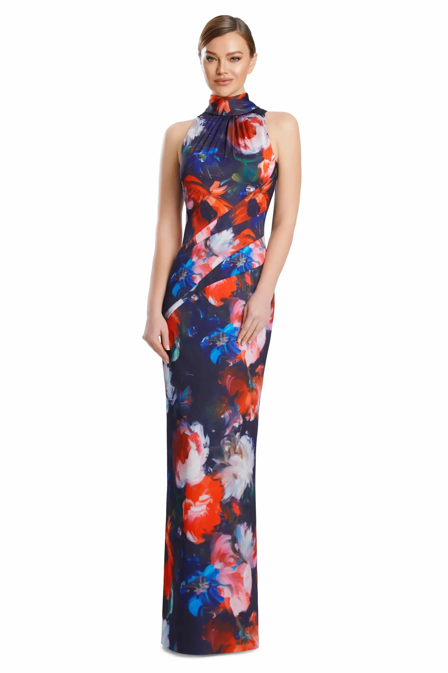 A woman wearing a long, form-fitting dress with a floral pattern in red, blue, and white colors. The dress has a halter neck design and fits closely to her body.