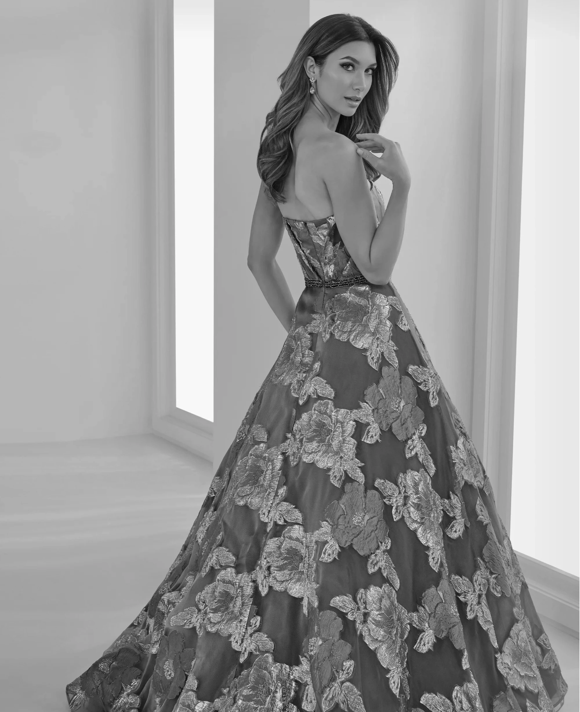 Model wearing a white black dress