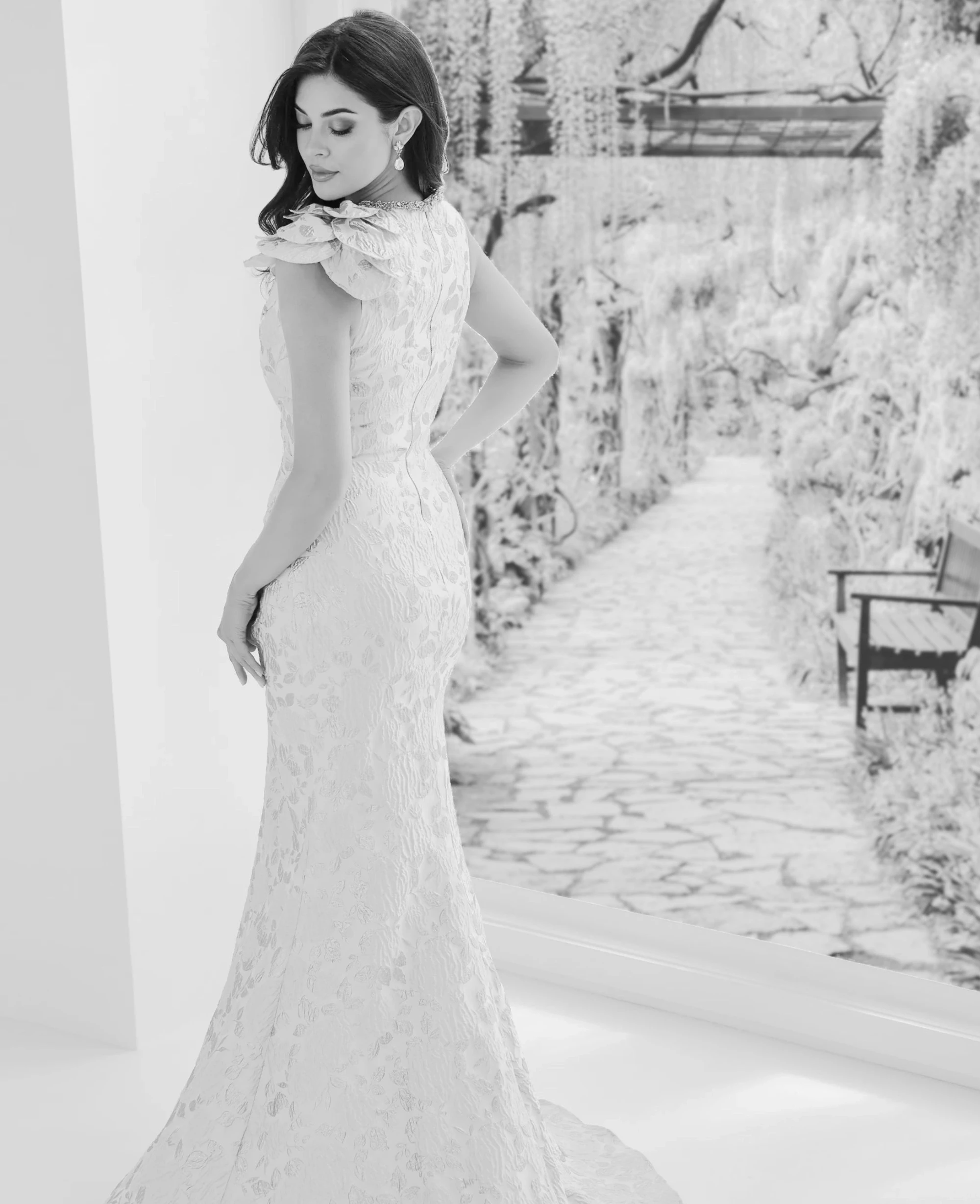 Model wearing a white black dress