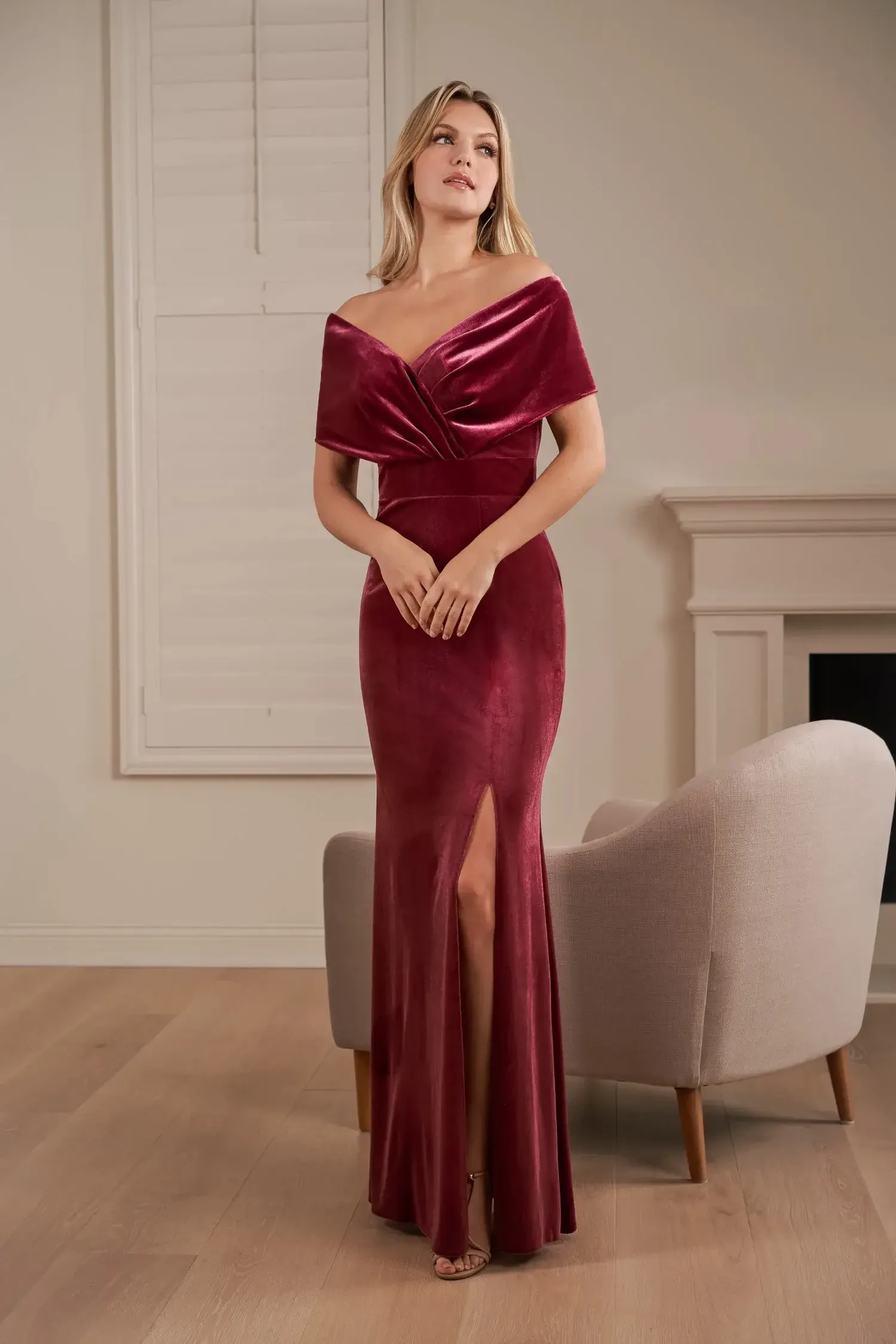 model is wearing a burgundy off the shoulder bridesmaid dress 