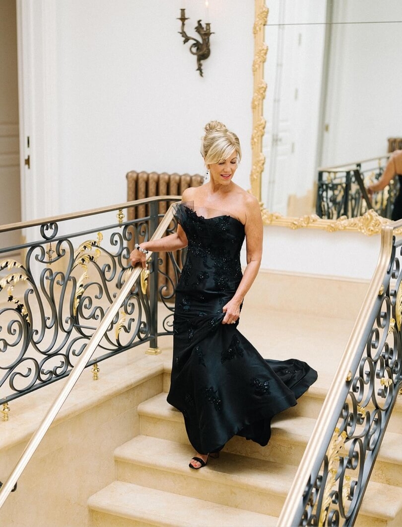 Model wearing a black bridal dress on the stairs