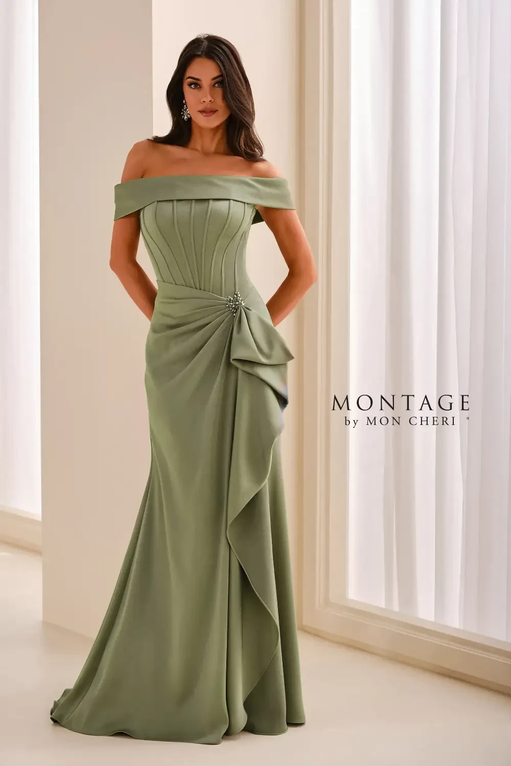 model is wearing a dark sage evening gown