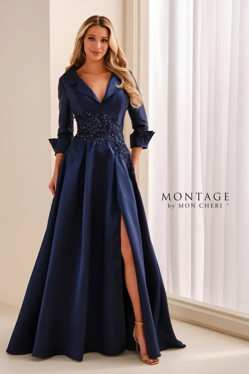 model is wearing a navy blue quarter sleeve evening dress